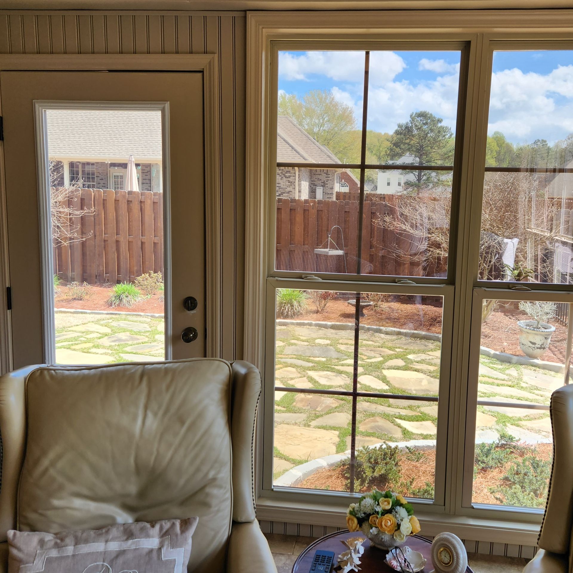 home tinting Prattville - Contrasting Sun Glare seen before last window and glass door are treated with SPF Tint in Prattville AL