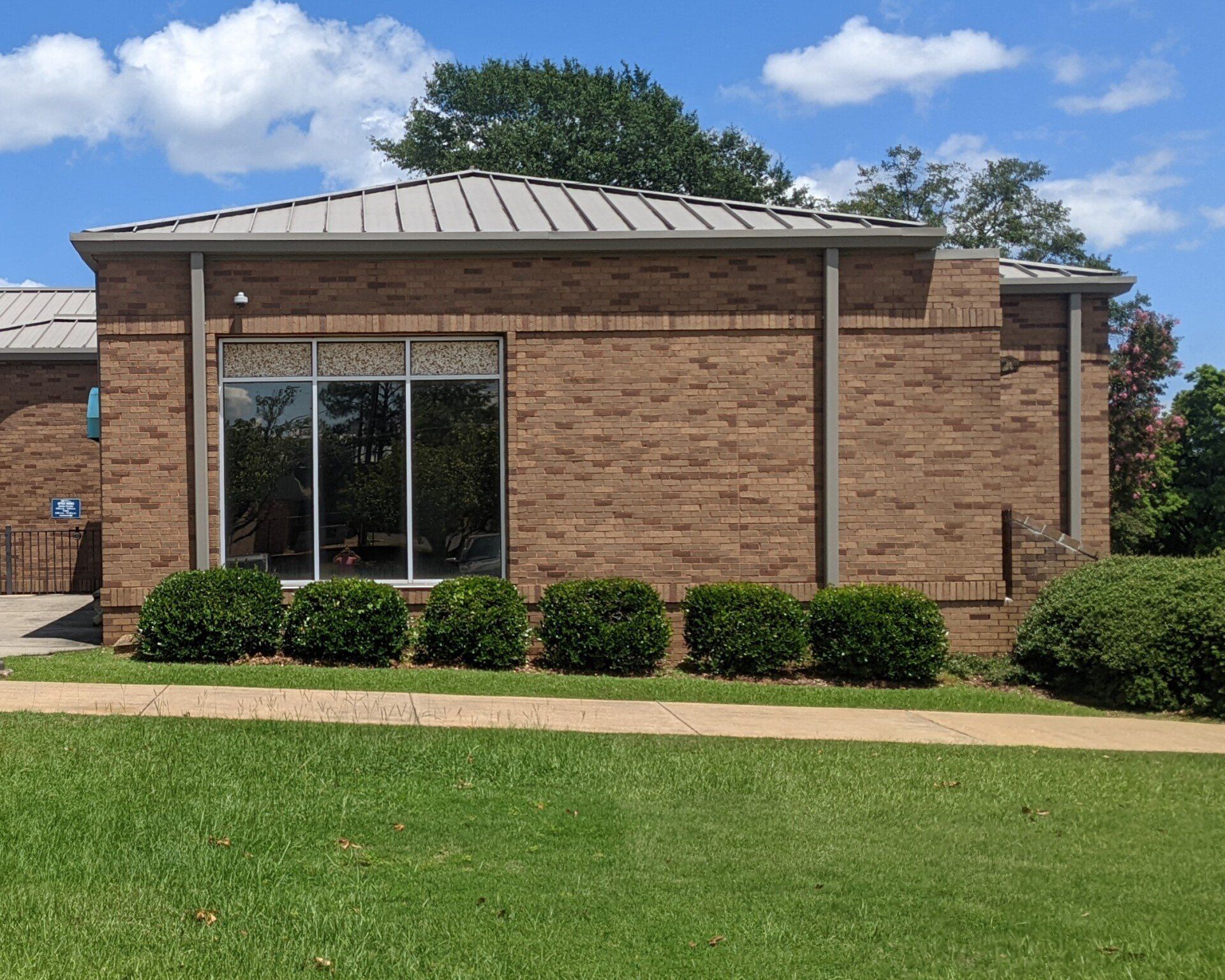 SPF Tint installed to windows stops hot Sun at Eastmont Church. Useless blinds allowing UV heat were removed for ideal office space in Montgomery, AL