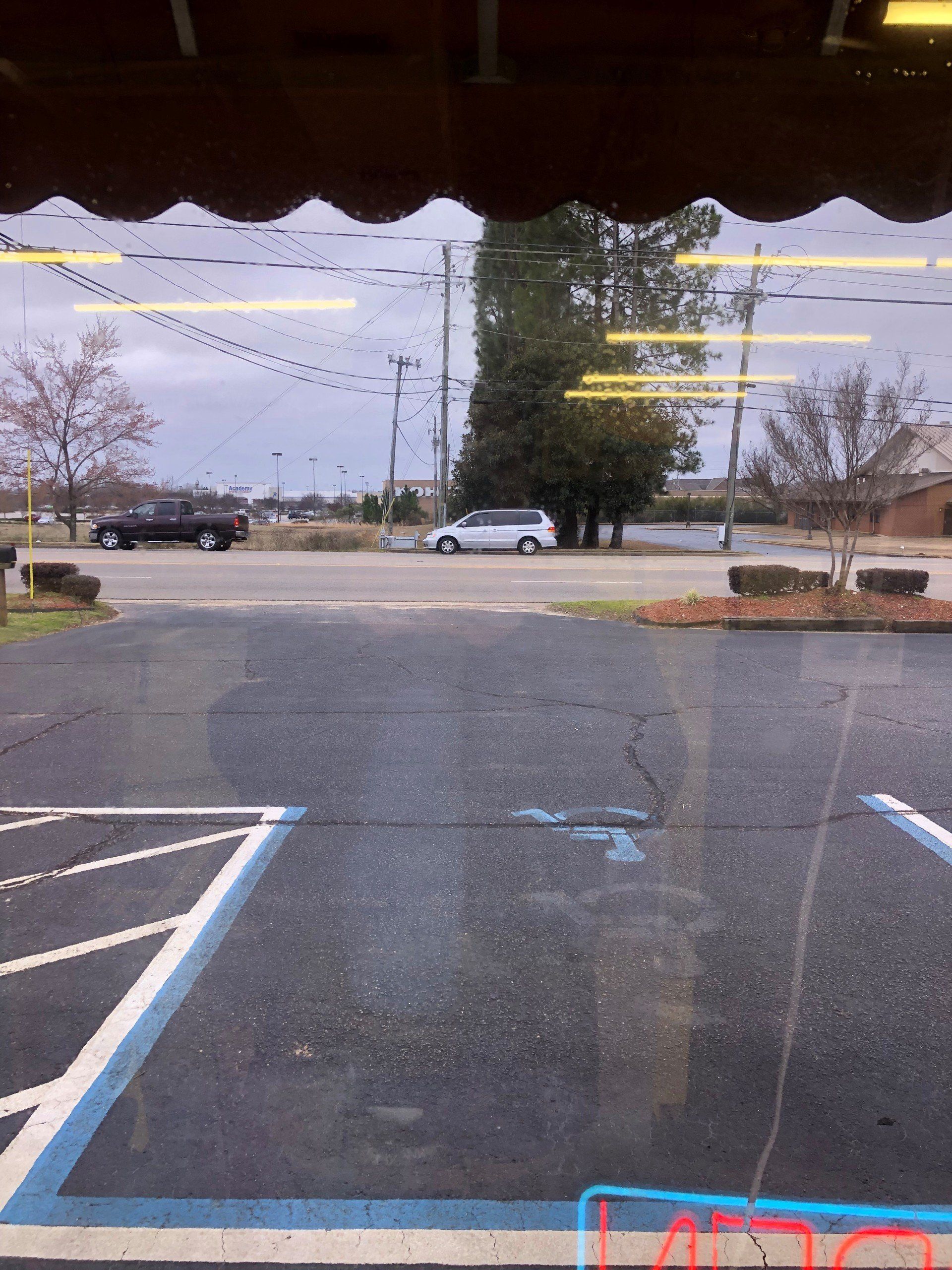 Store tint installation in Prattville AL on 1.14.2019 - before generic tint removal looking out foggy business windows