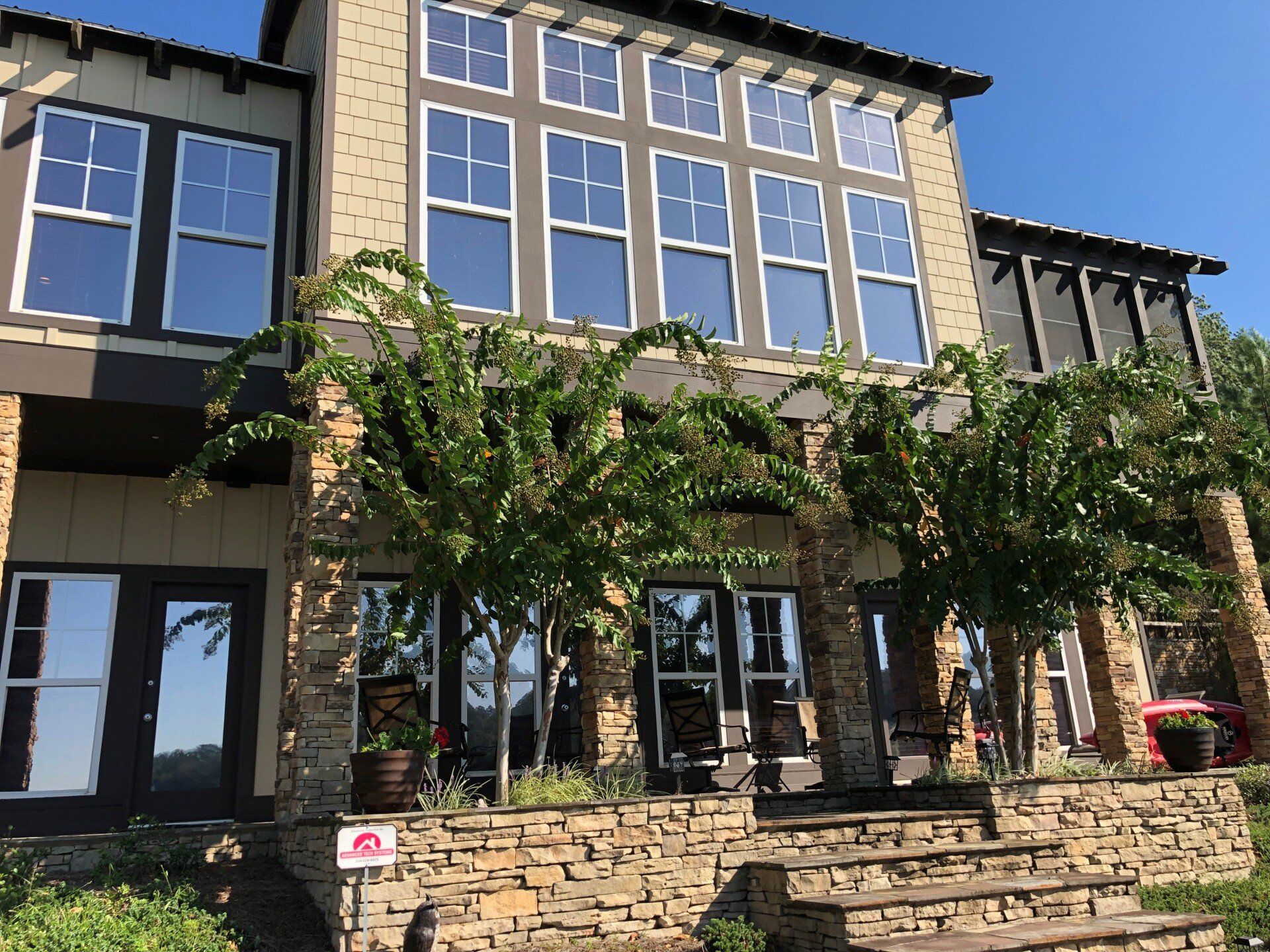 energy efficient home windows at lake Martin - SPF Sunlit Platinum Lake House Tint blocks heat gain adding even comfort inside home windows. Dadeville, AL