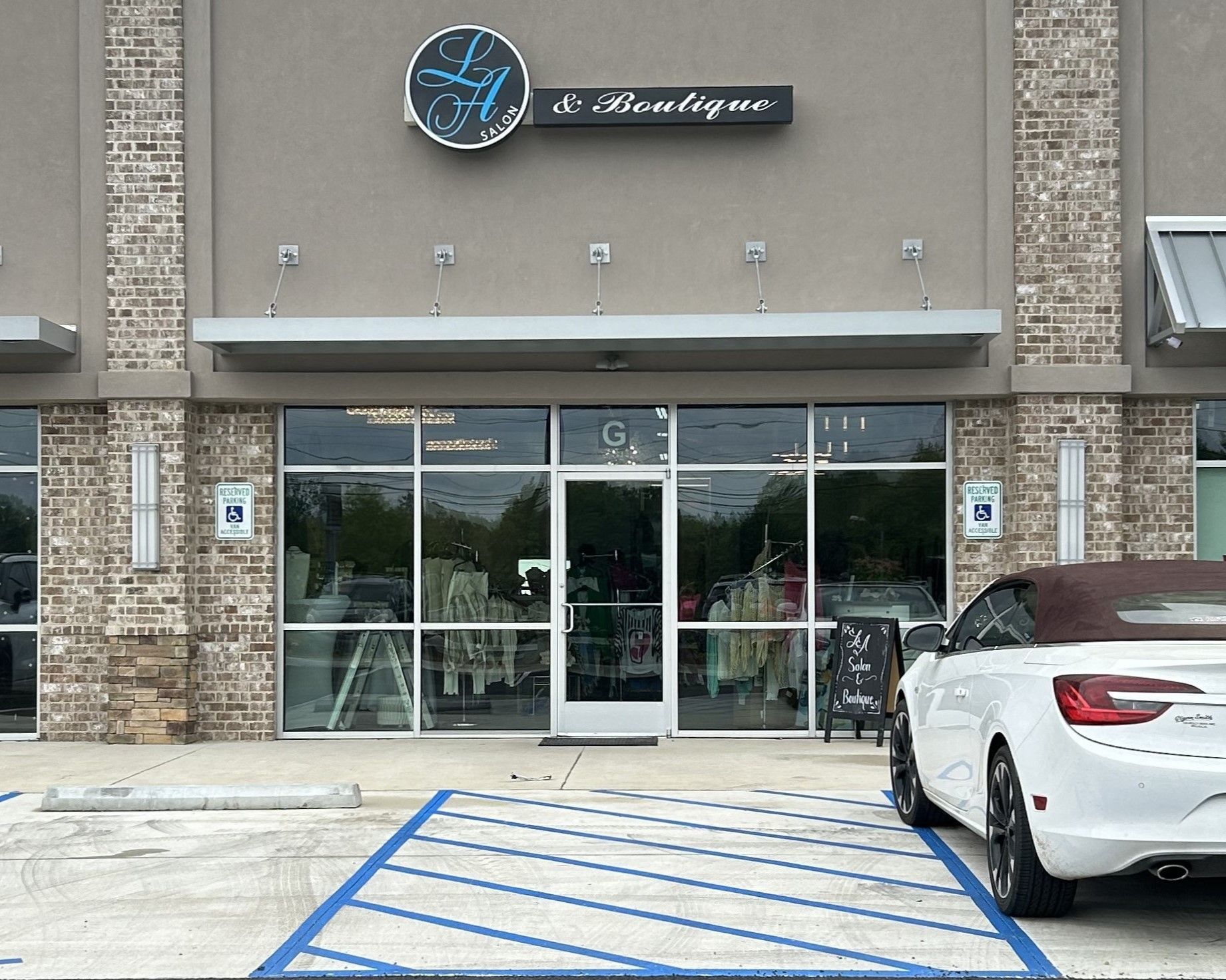 commercial tinting - SPF Tinting blocks the most heat gain with bright UV Sun entering storefront windows adding top efficiency and perfect lighting inside at the new LA Salon in Opelika, AL