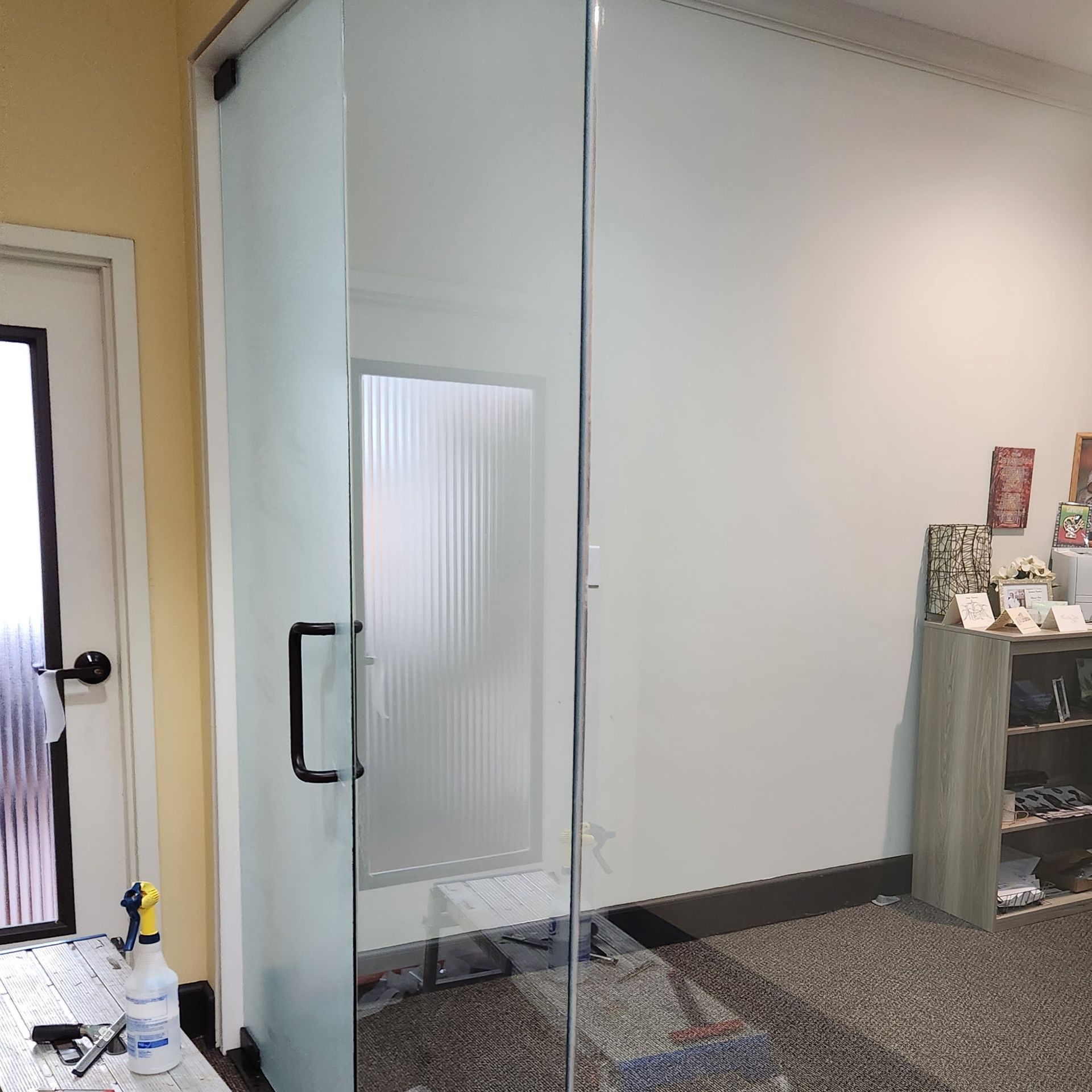 The office windows and glass doors needed privacy with modern function and style. Prior to SPF Frosted glass treatment service in Montgomery AL.