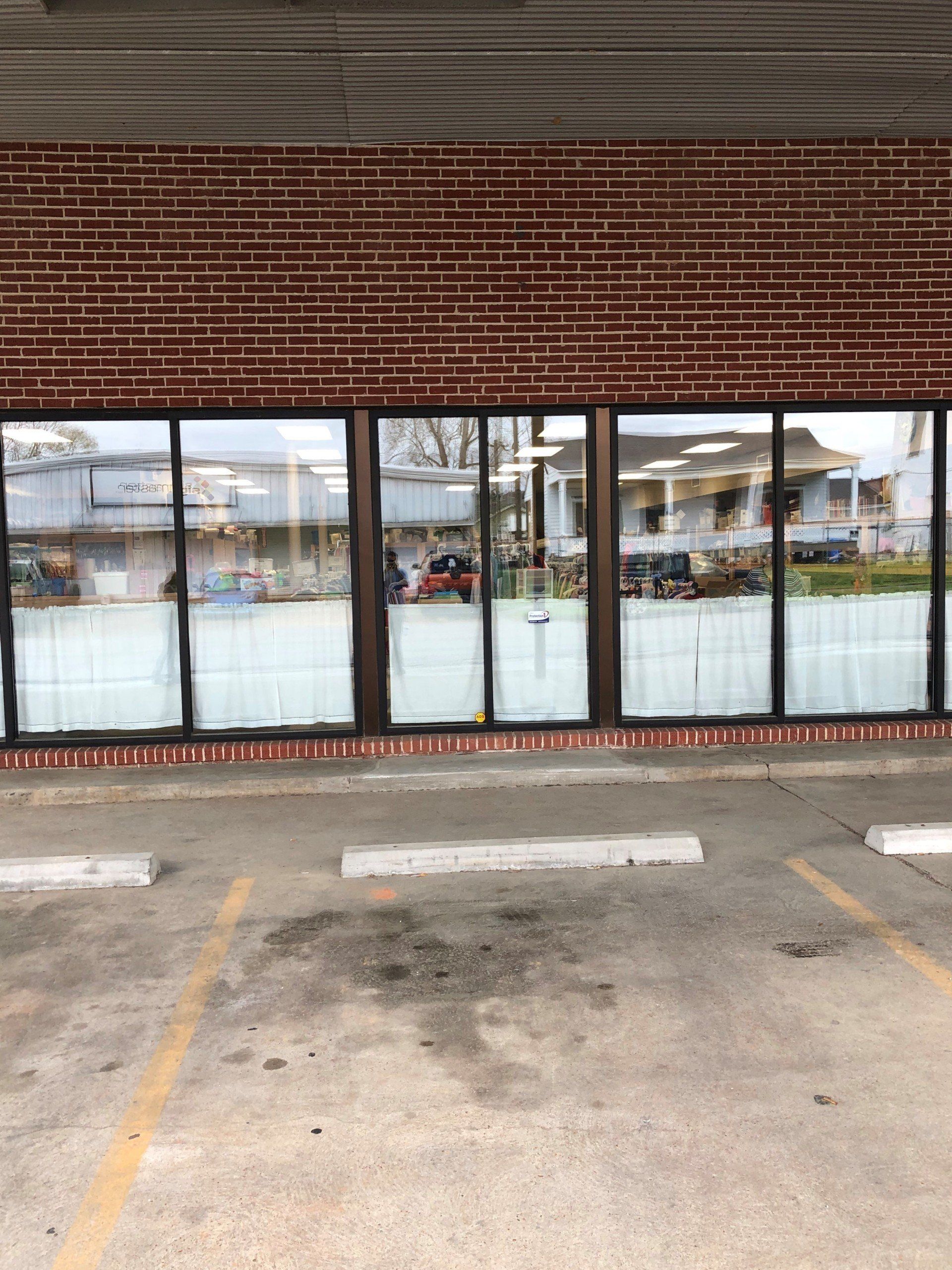 Business tinting professionals - removed 3foot high curtains and installed white frost busines tint 3-foot up in Prattville, AL
