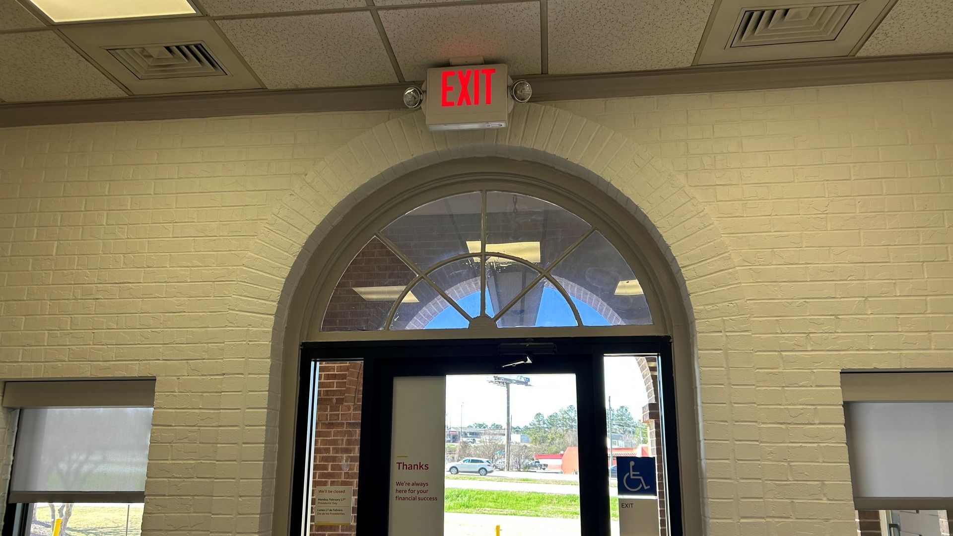 window tinting service cutting hot UV Sun - old failed tint removal and replacement with real SPF Crystal Clear storefront Tint in Phenix City, AL.