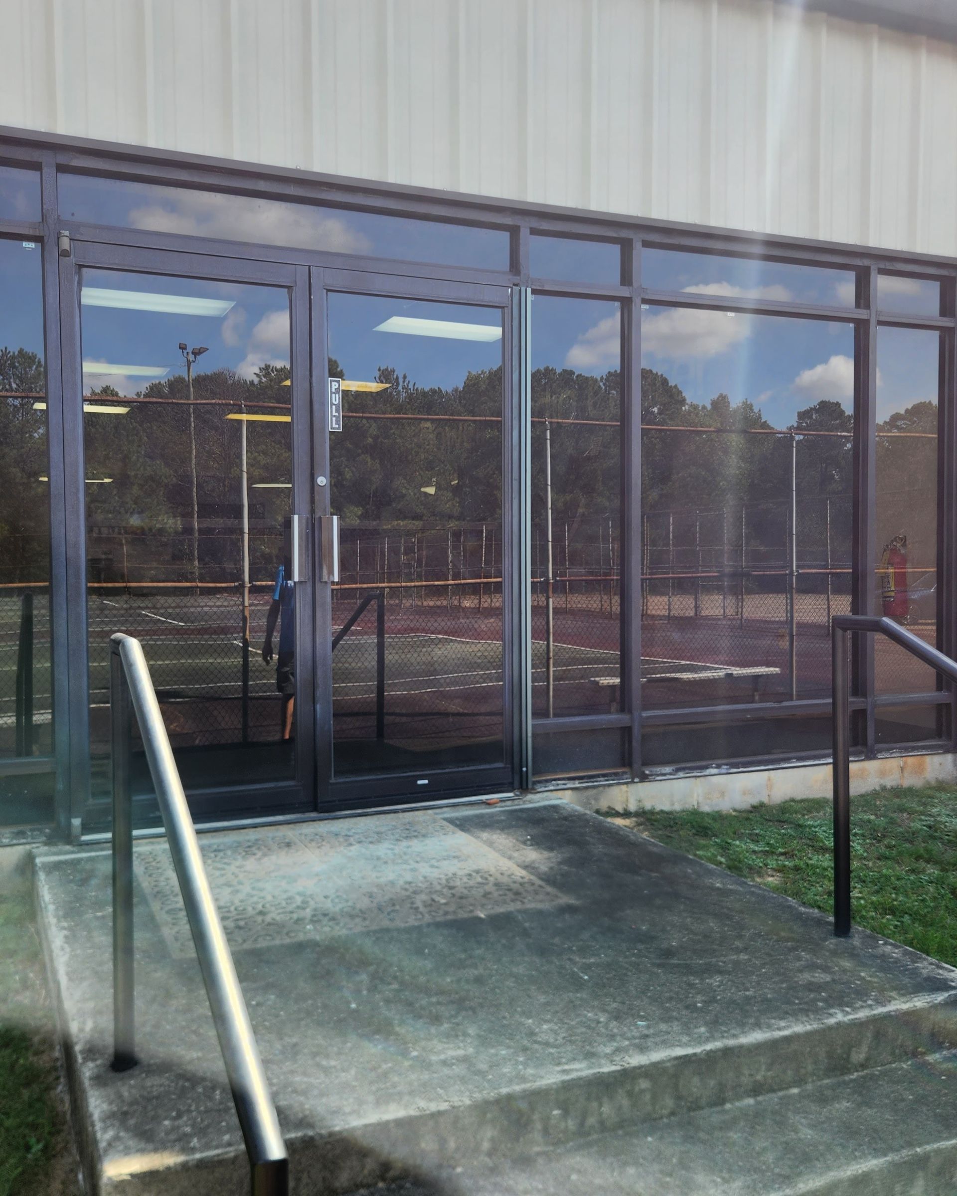 Prattville YMCA gym windows in Prattville Alabama seen here before spf ultra tint was installed adding storm-proof insulation with one-way privacy. Plus top heat-rejection and full UV glare reduction. Prattville AL