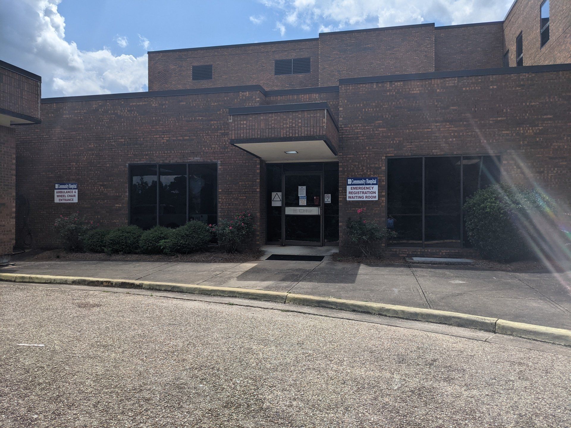 business storefront window tinting - Before Generic Tint Removal. The heat was coming in nearly full force making everyone miserable and energy costs high at Community Hospital in Tallassee, AL