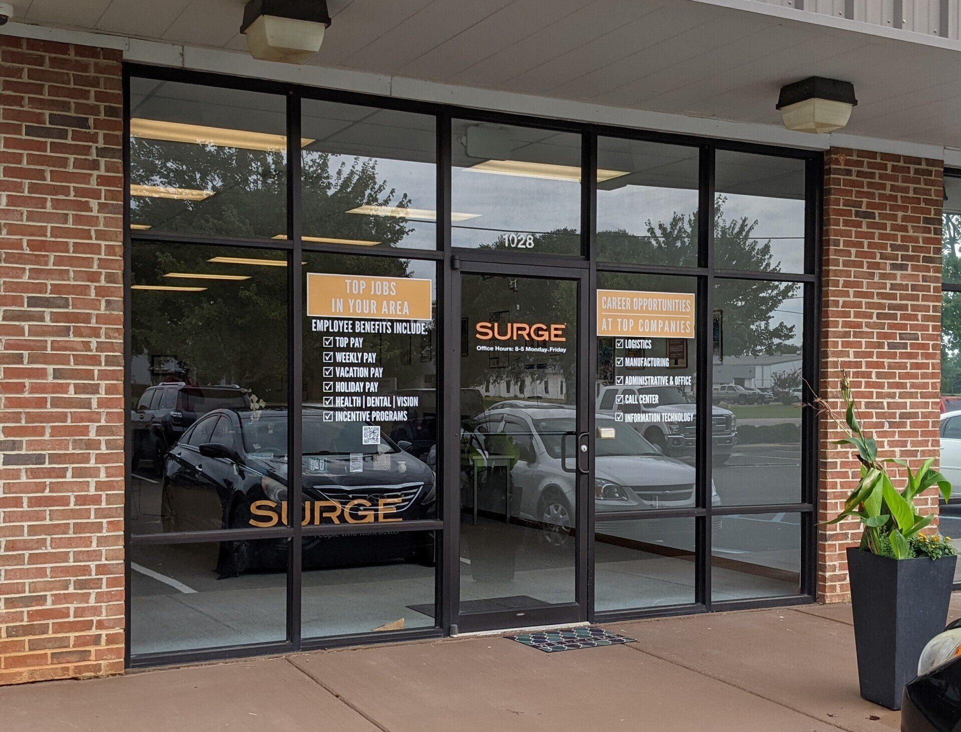 Storefront energy efficiency Tinting - Heat and UV Glare pushed inside Surge Staffing's office. Before SPF ULTRA  Performance Tint in Prattville, AL