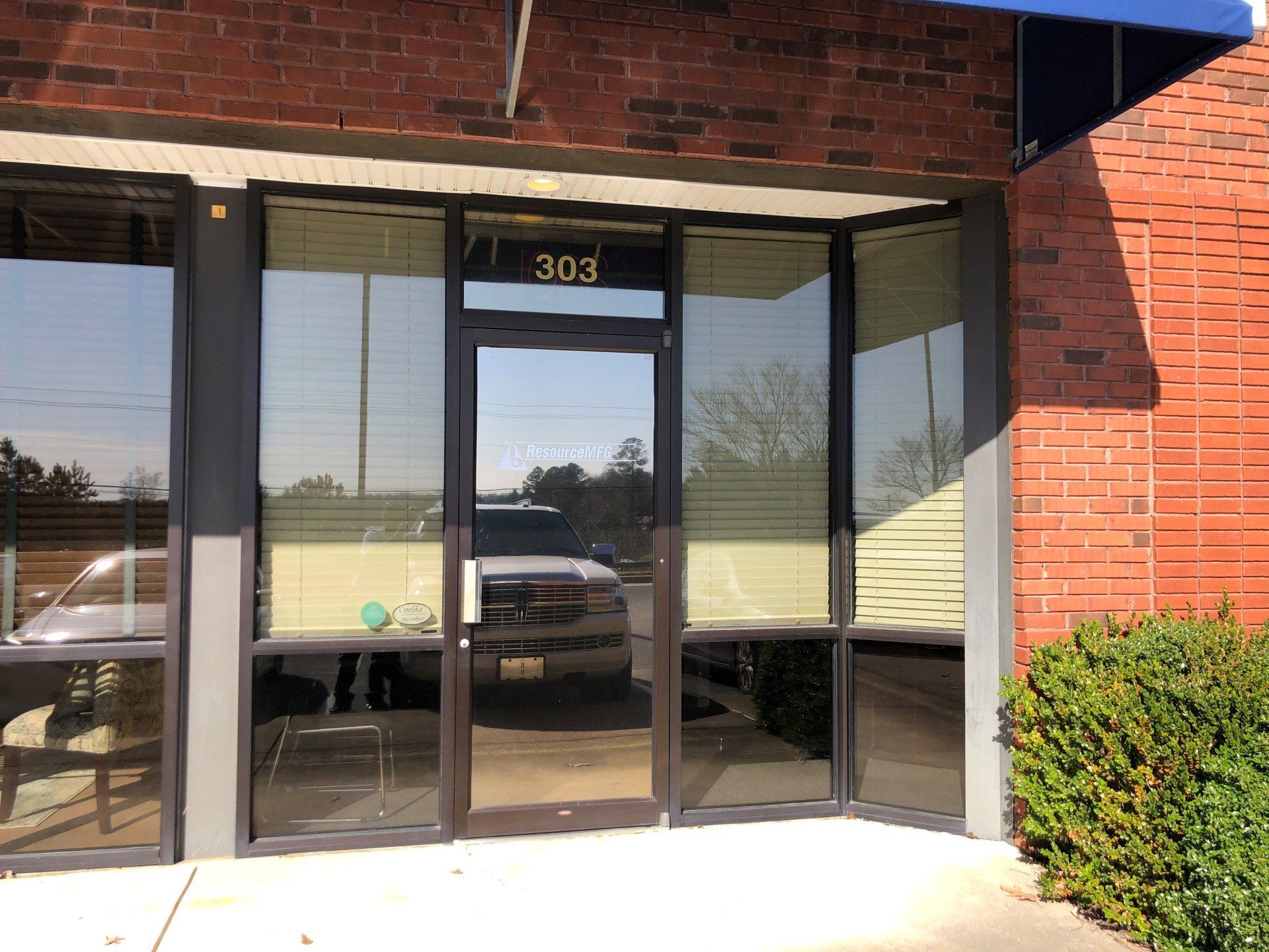Office Window Tinting in Auburn, AL - SPF Office Tint was installed to the door and transom window. Ending bright Sun glare in Auburn AL