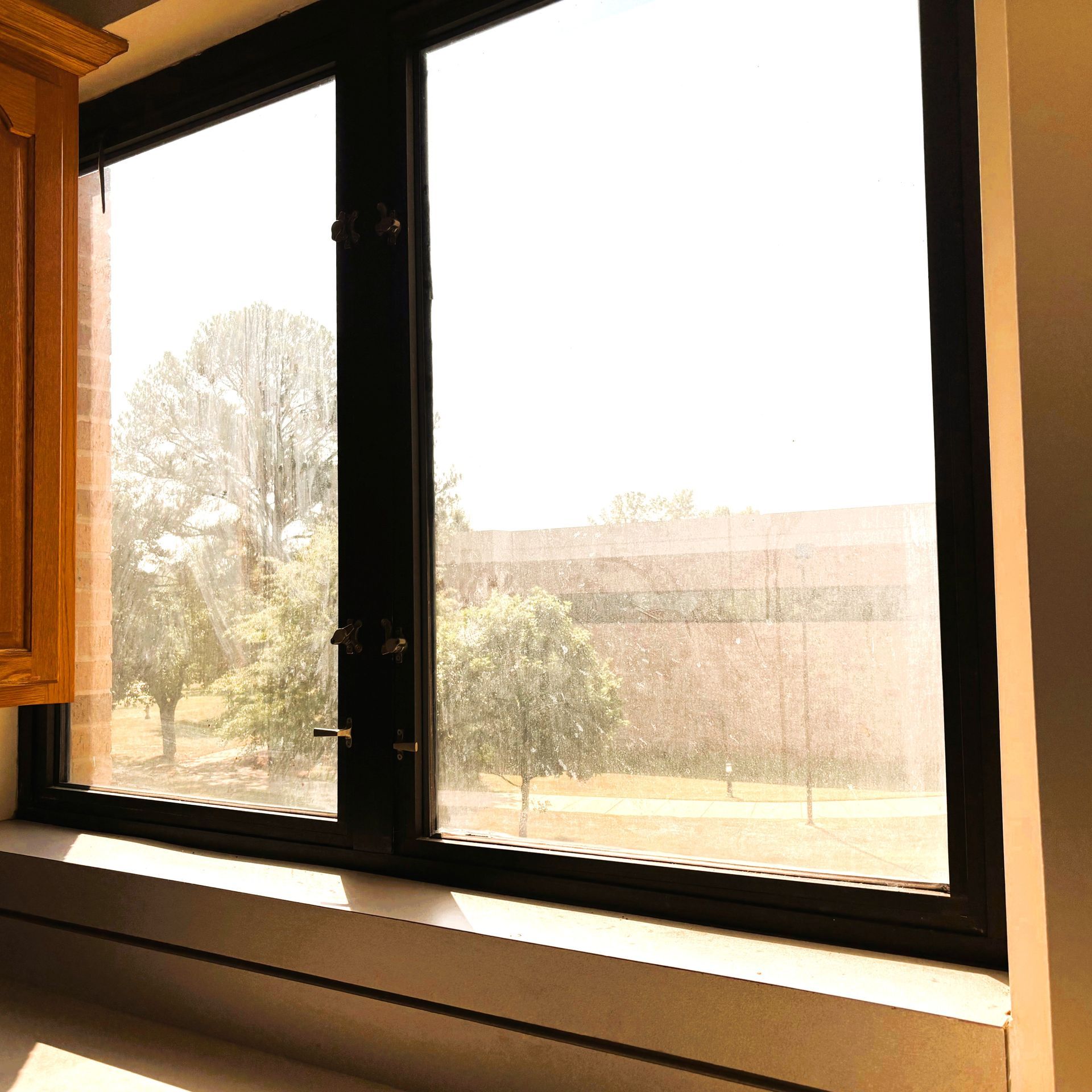 home or business window tinting - Bright Sun glare with harmful UV-Light flooded the office windows at Maxwell AFB in Montgomery AL.