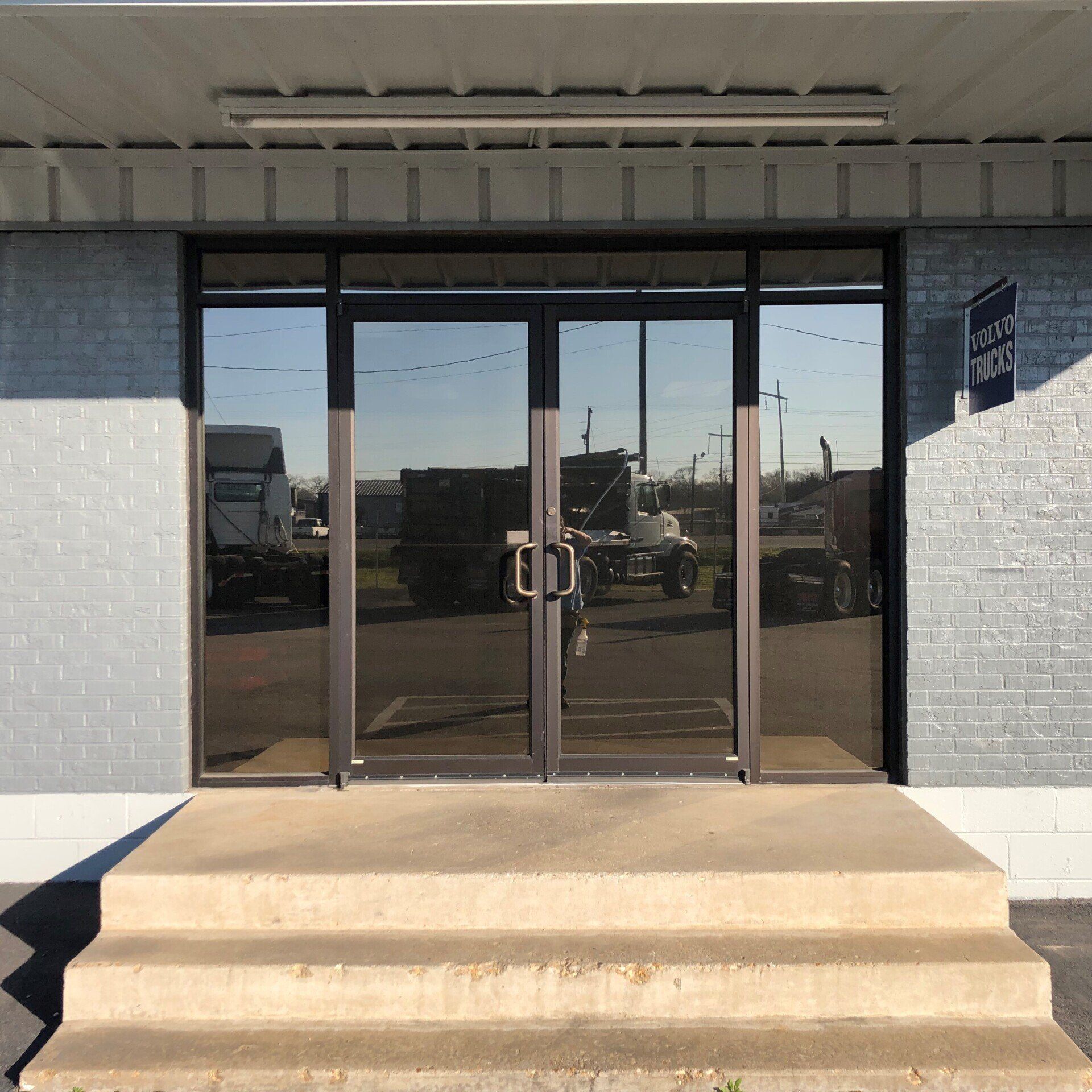 business storefront tinting - SPF Supreme View Tint Leads it's class in Performance and HD Clarity inside looking out. Volvo Trucks storefront tinted on 3.1.2021 in Montgomery, AL