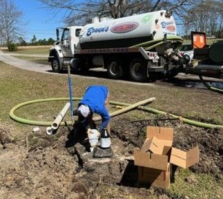 A technician during a septic tank repair process.