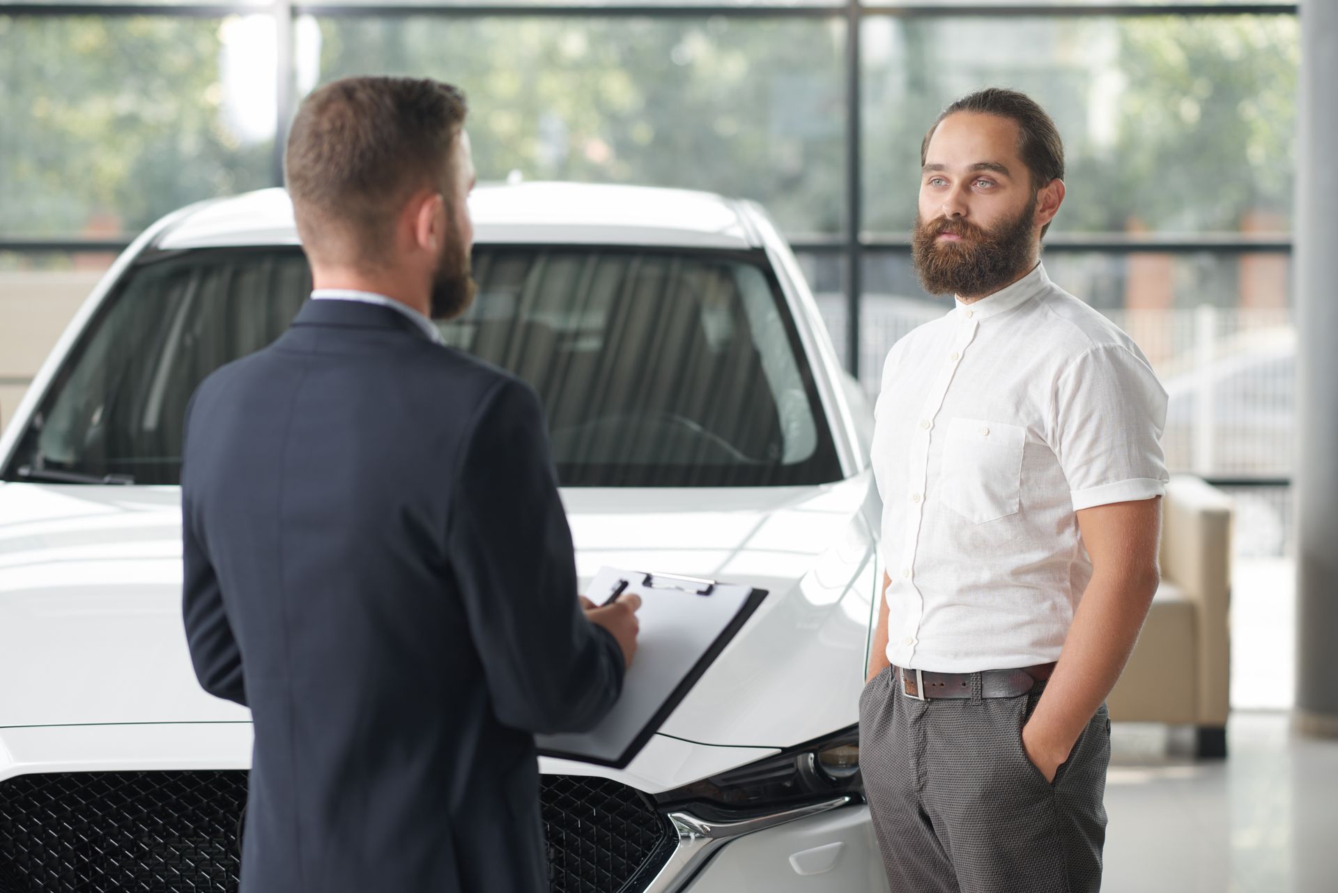 Car rep signing over car to customer