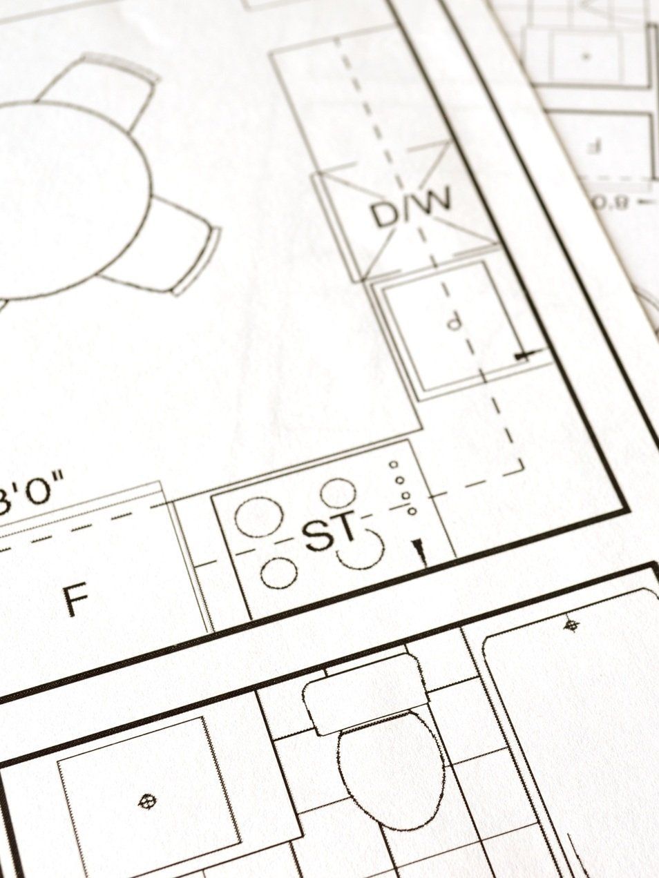 A black and white plan drawing of a l shaped kitchen 