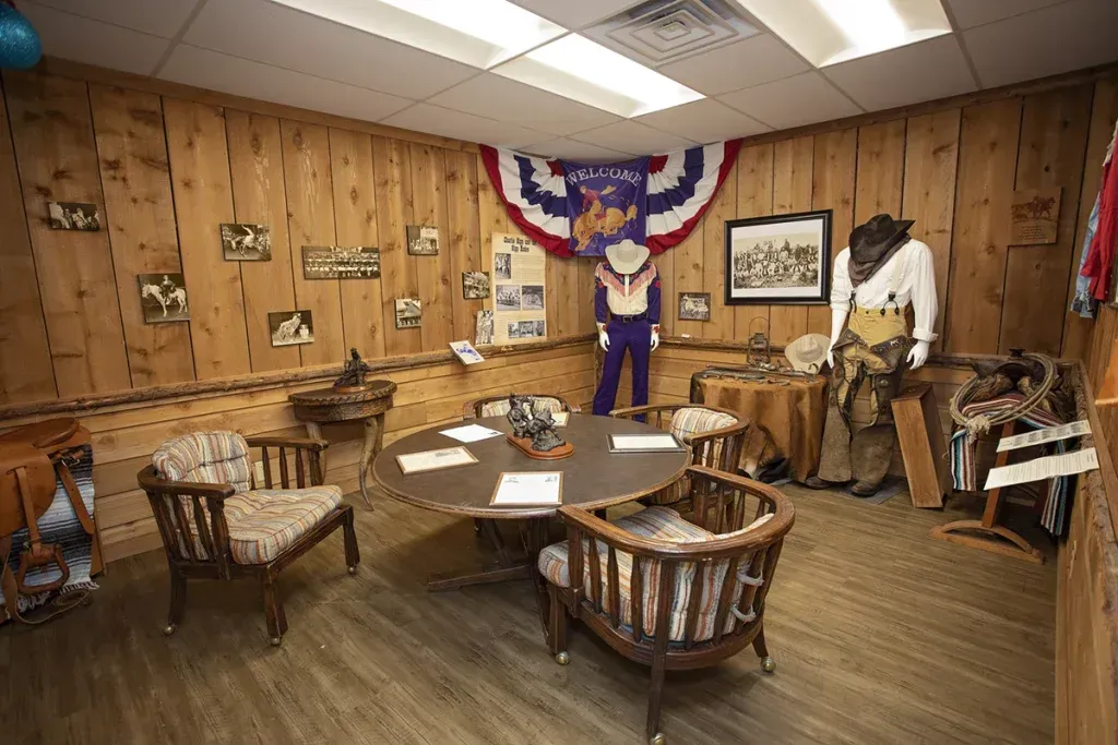 A room with wood paneling and a table and chairs in it