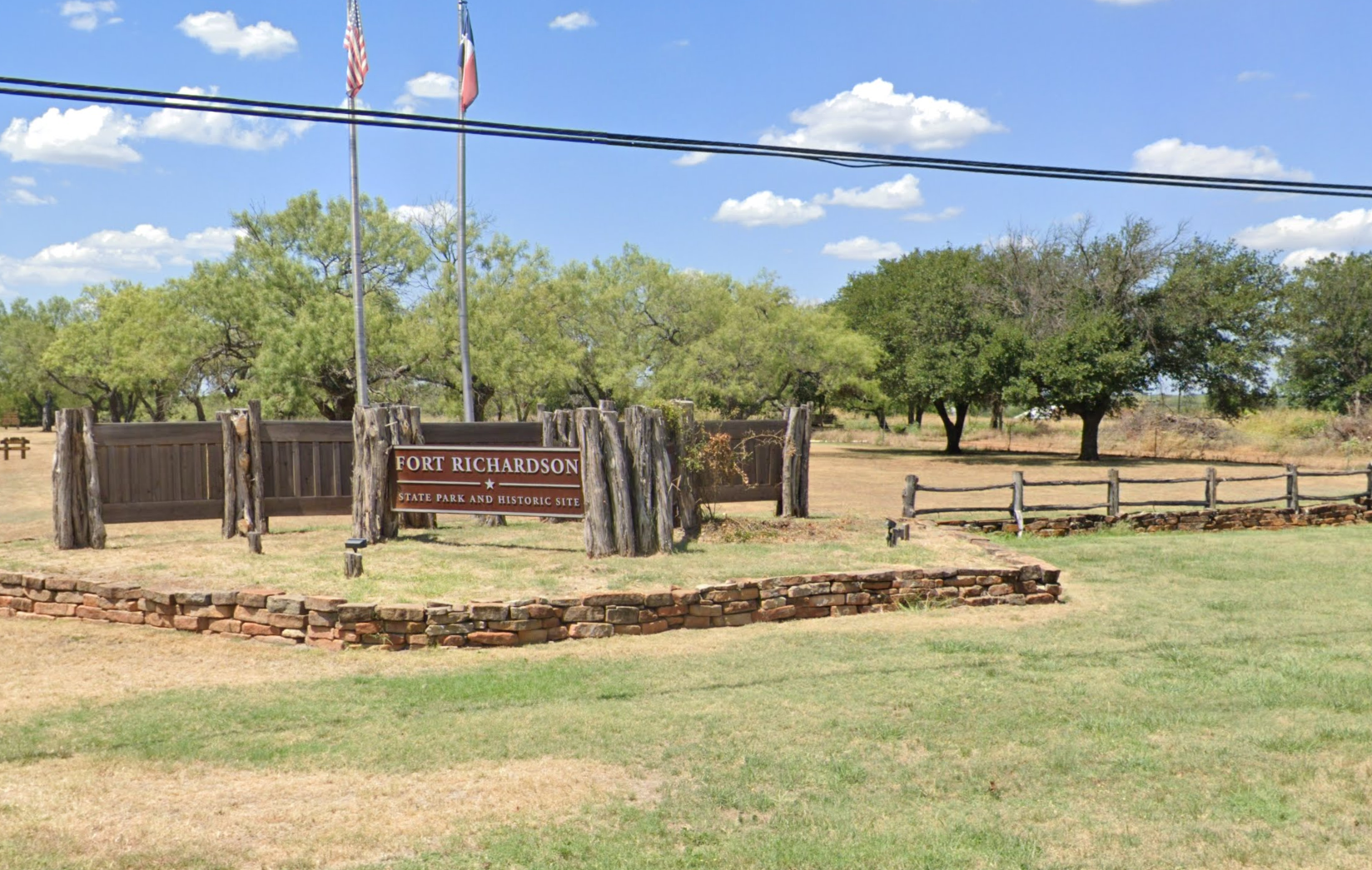A fenced in area with a sign that says park elementary