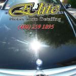 A close up of a car hood with a sticker on it.