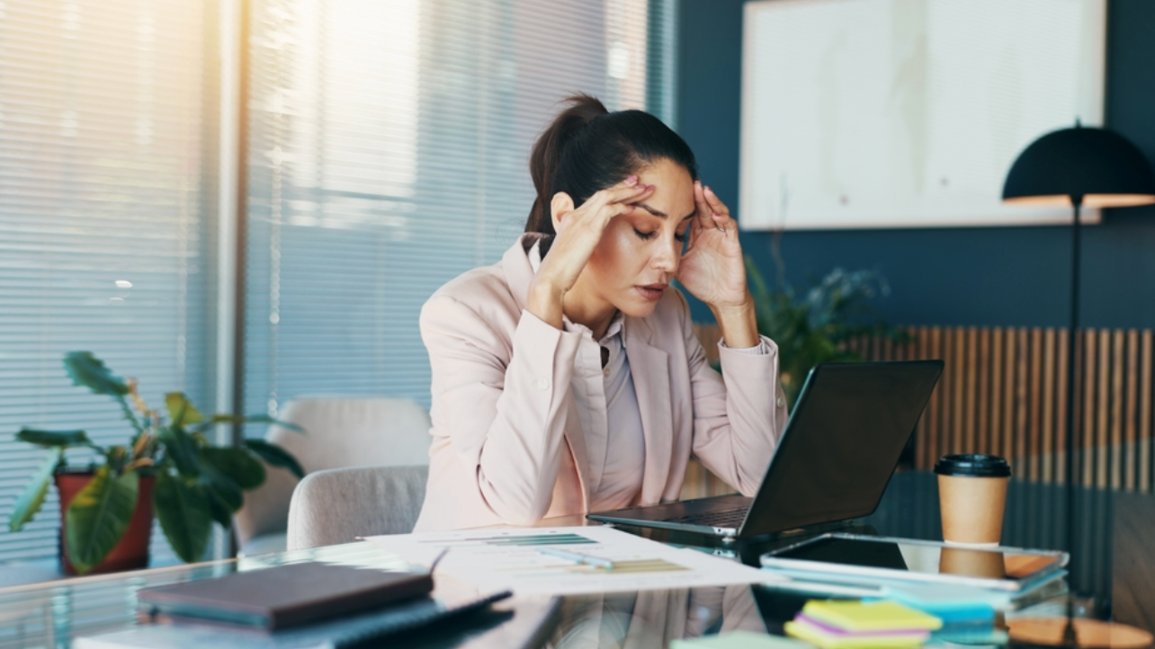 Ron Shaich is smiling in front of a panera bread store