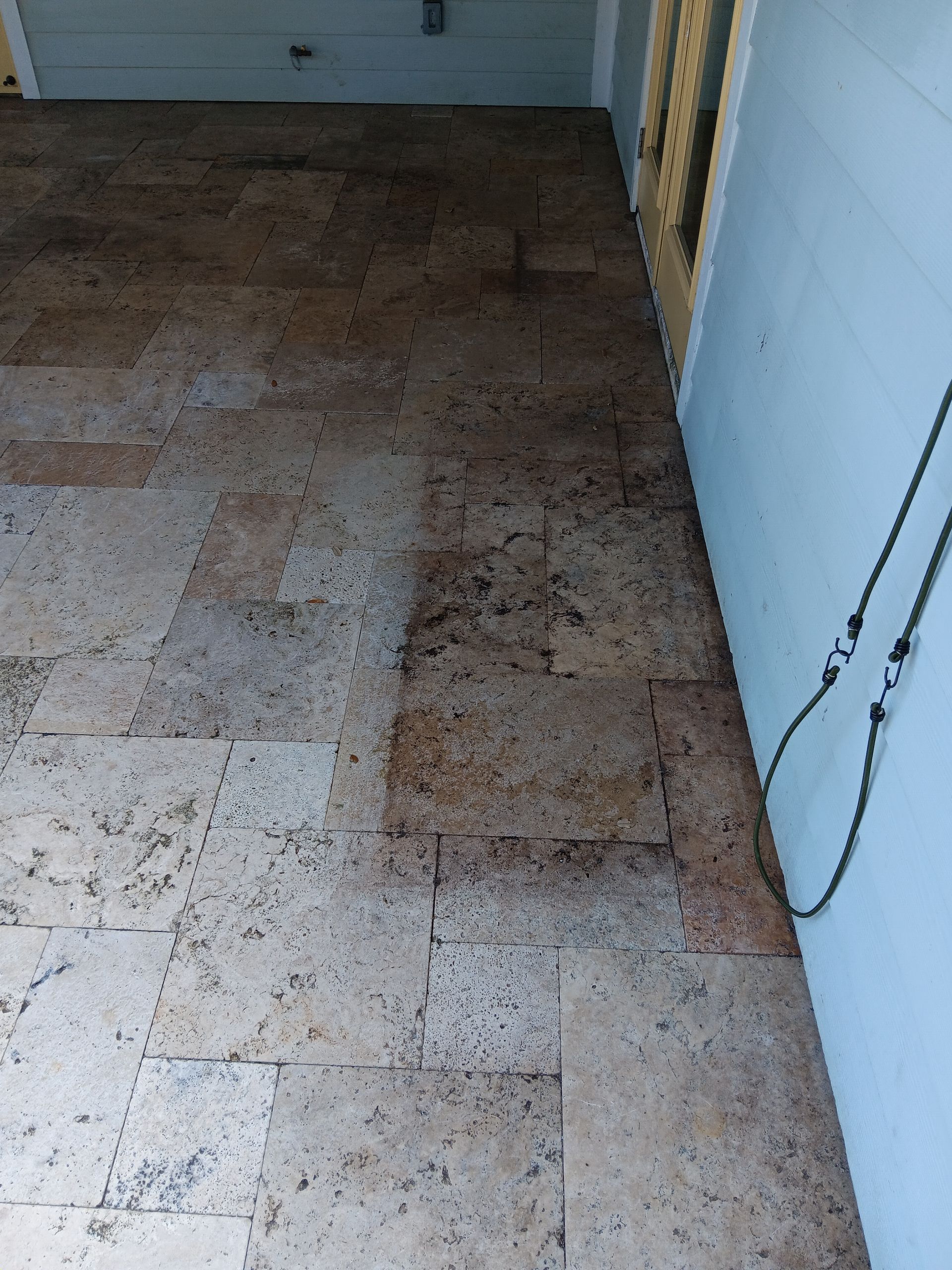 A close up of a tiled floor in a garage