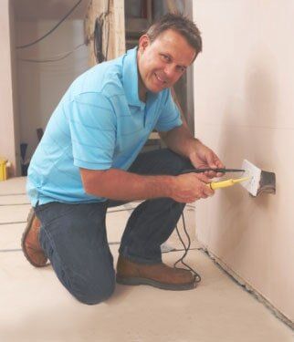 Electrician Installing Wall Socket - Electricians, electrical contractor in Goodhue, MN