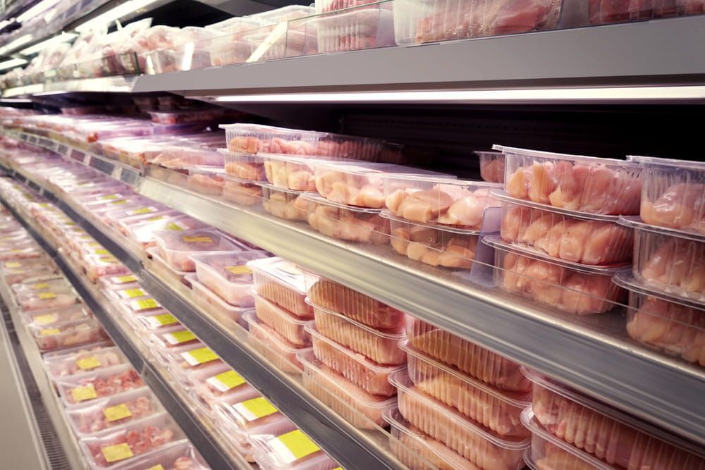 A Grocery Store Aisle Filled With Plastic Containers of Meat — Refrigerated Technologies (QLD) Pty Ltd In Airlie Beach, QLD