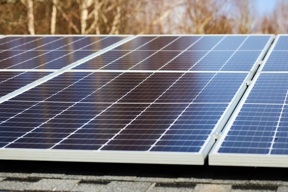 A Row of Solar Panels Are Sitting on Top of a Roof — Refrigerated Technologies (QLD) Pty Ltd In Proserpine, QLD