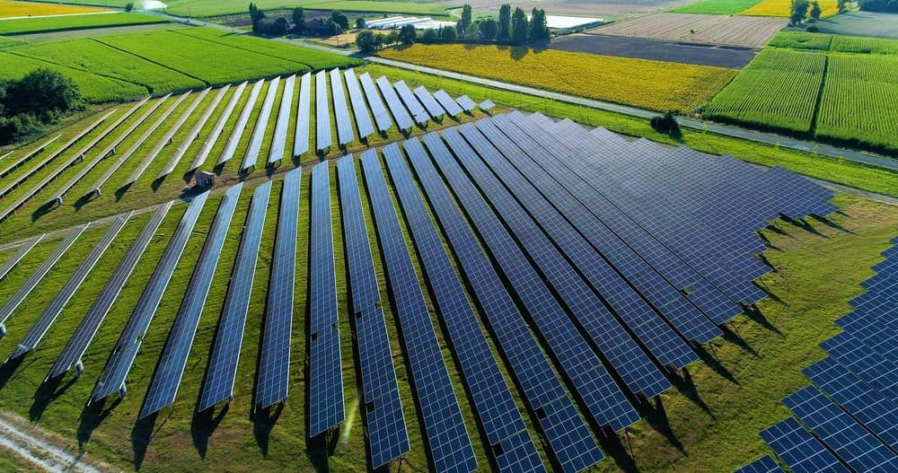 An Aerial View of a Row of Solar Panels in a Field — Refrigerated Technologies (QLD) Pty Ltd In Airlie Beach, QLD