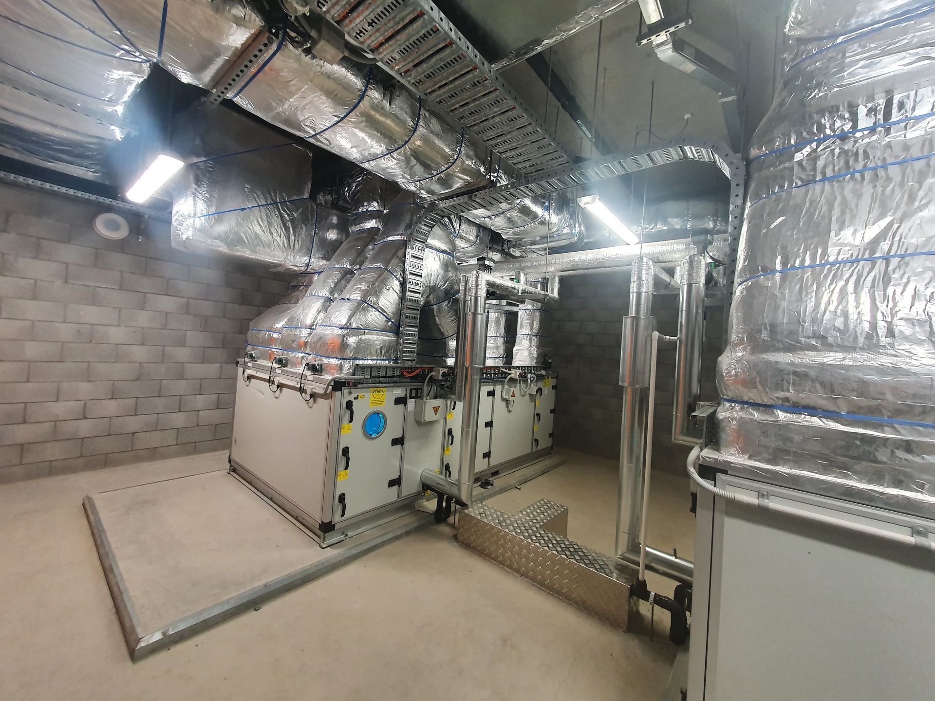 A Large Room With a Lot of Pipes Coming Out of the Ceiling — Refrigerated Technologies (QLD) Pty Ltd In Bowen, QLD