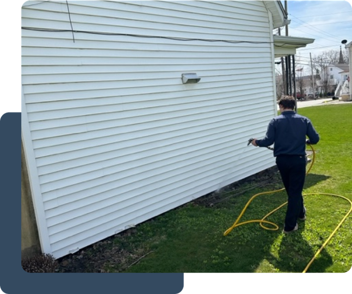 Pest control services, spraying the outside of a house to prevent pest infestation in johnstown pa