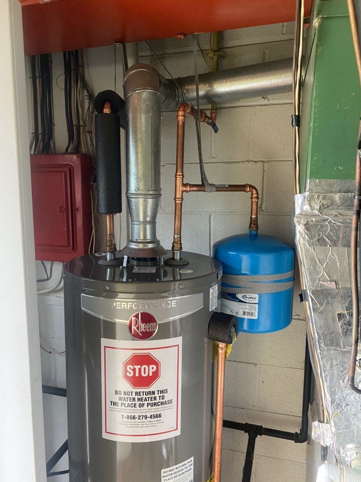 a water heater with a stop sign on it