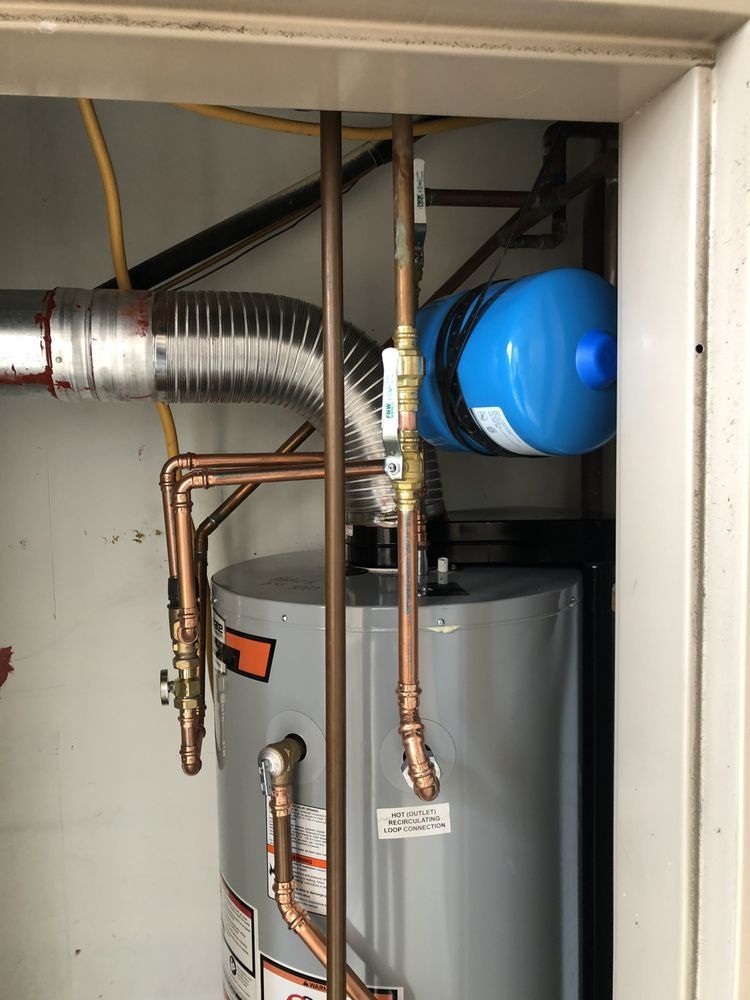 a water heater with copper pipes and a blue tank