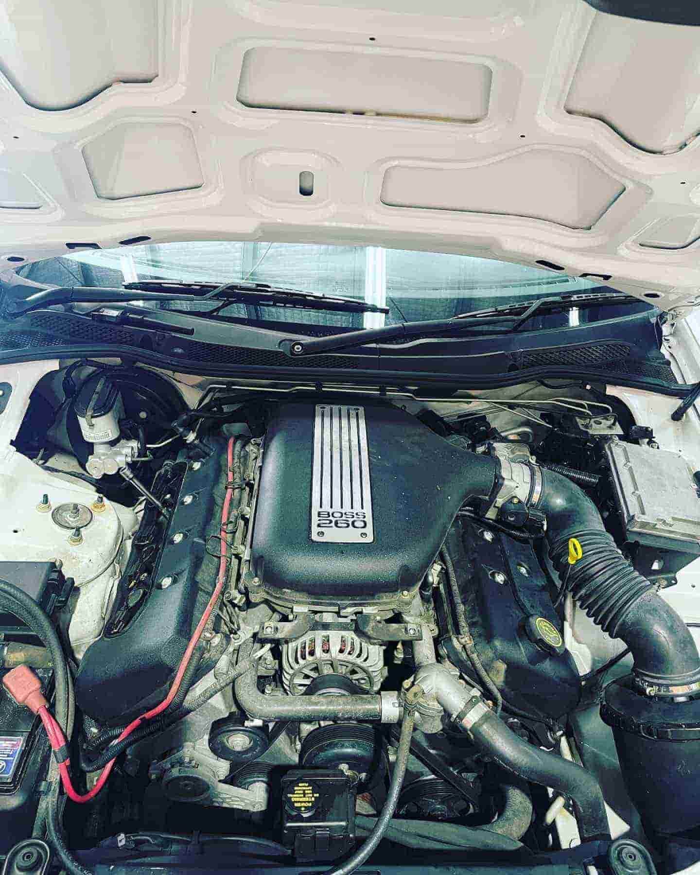 Engine of a White Car with the Hood Open — Certified Mechanic in Canberra, ACT
