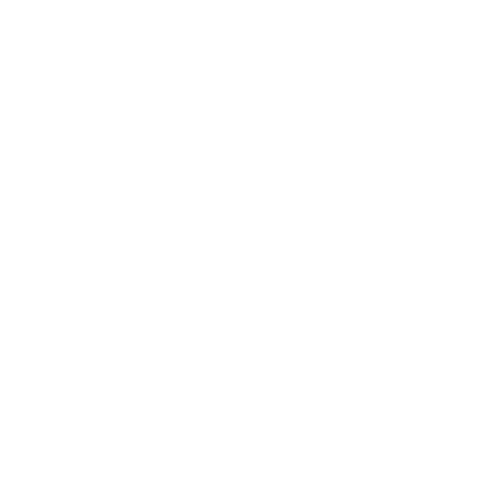 A close-up of a small, bright yellow chick standing on a dark, textured surface.