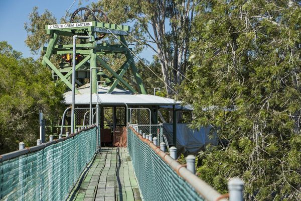 A Suspension Bridge Leading to a Building Surrounded by Trees — ASAP Towing Pty Ltd in Gympie, QLD