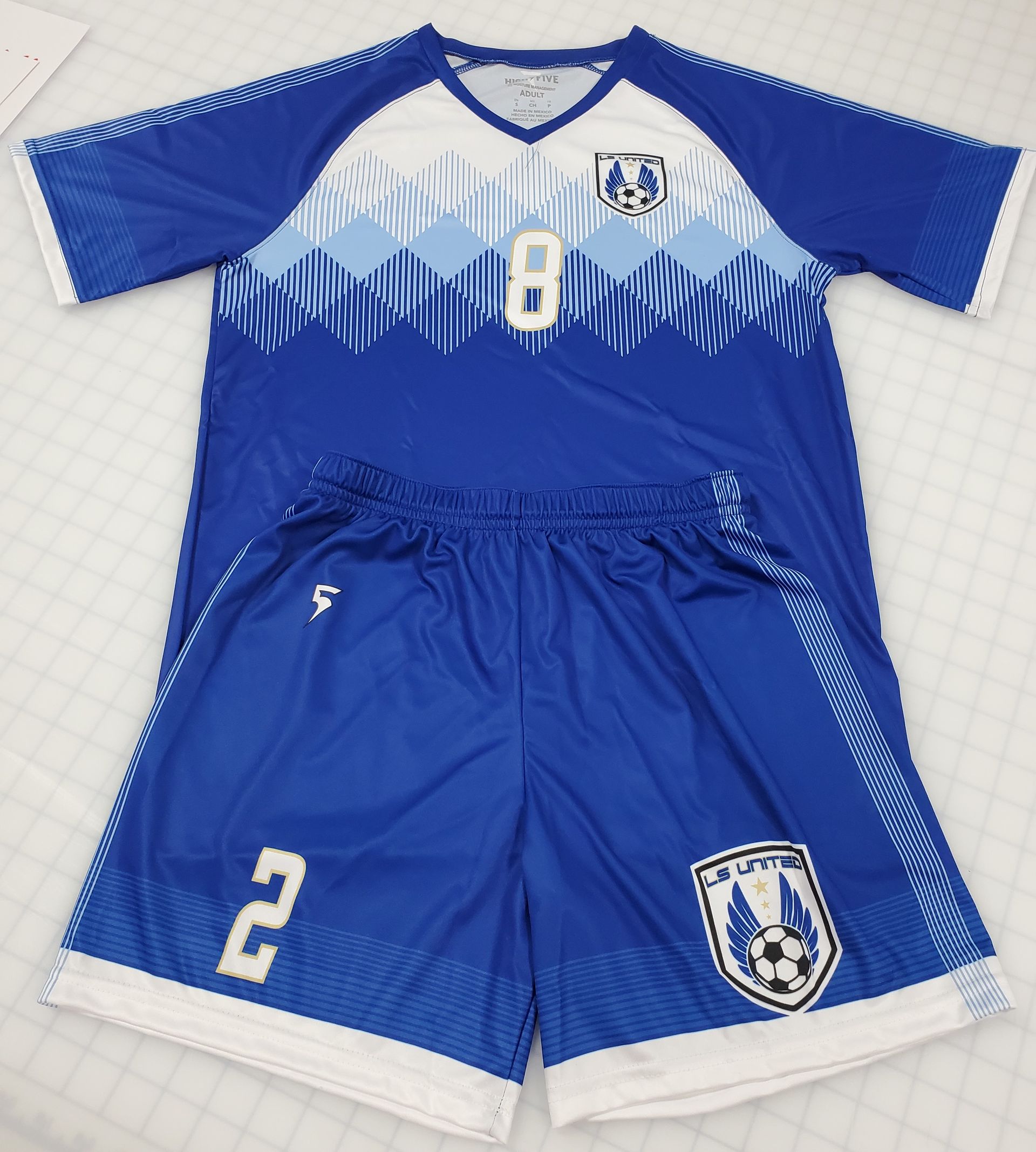 Blue and white soccer uniform with the number 8 on the shirt and number 2 on the shorts.