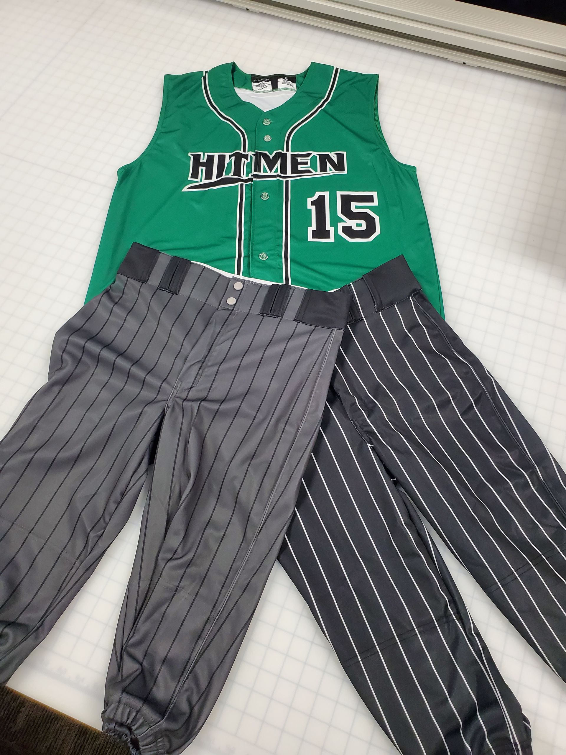 Green and white baseball jersey