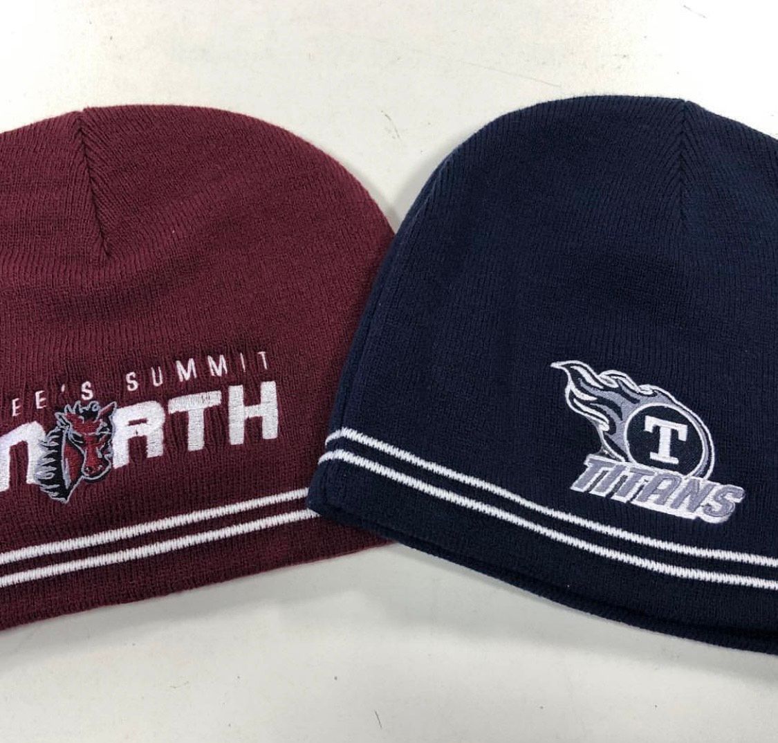 Two knitted beanies: one maroon and one navy