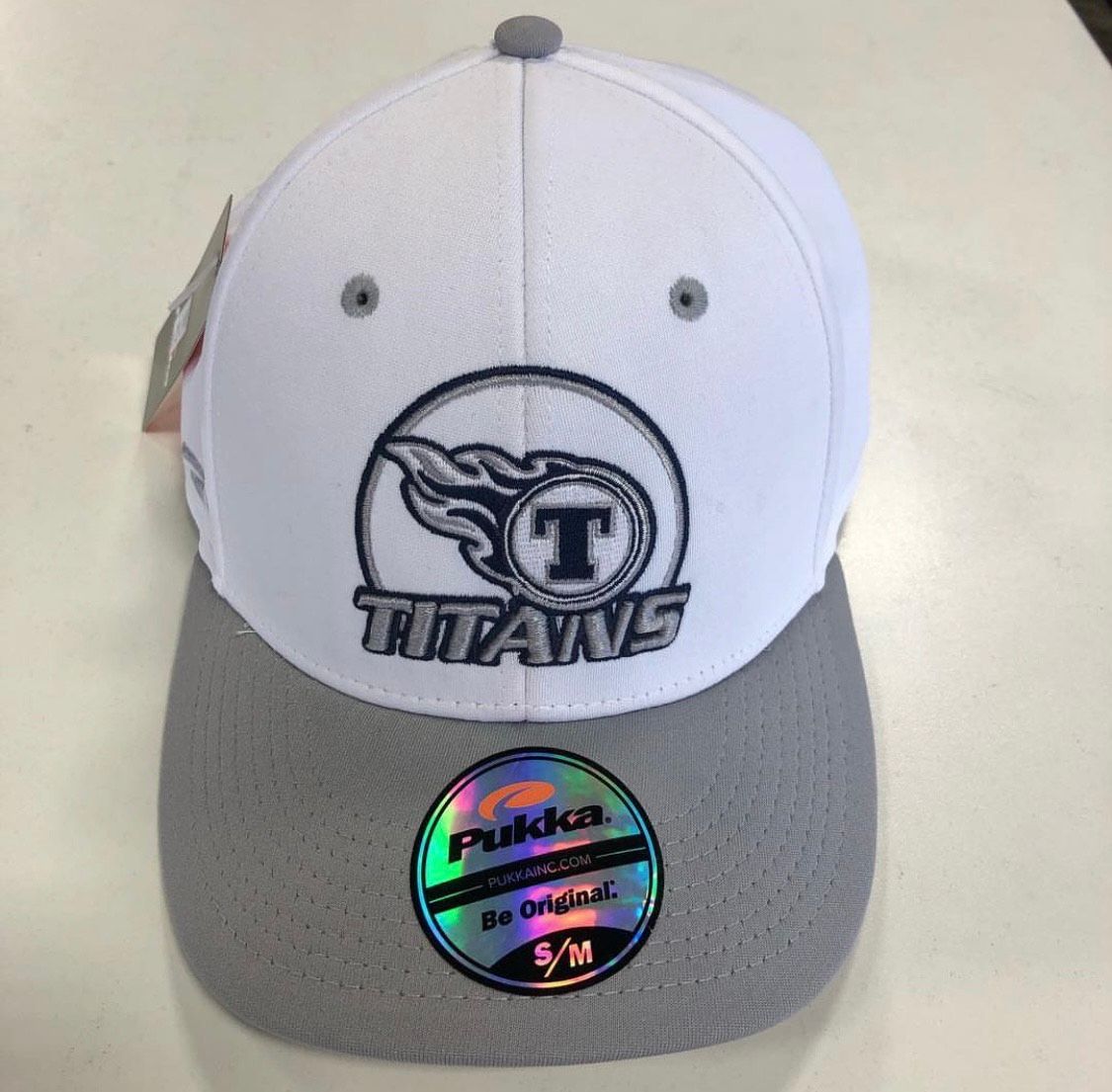 White and gray Titans baseball cap with team logo.