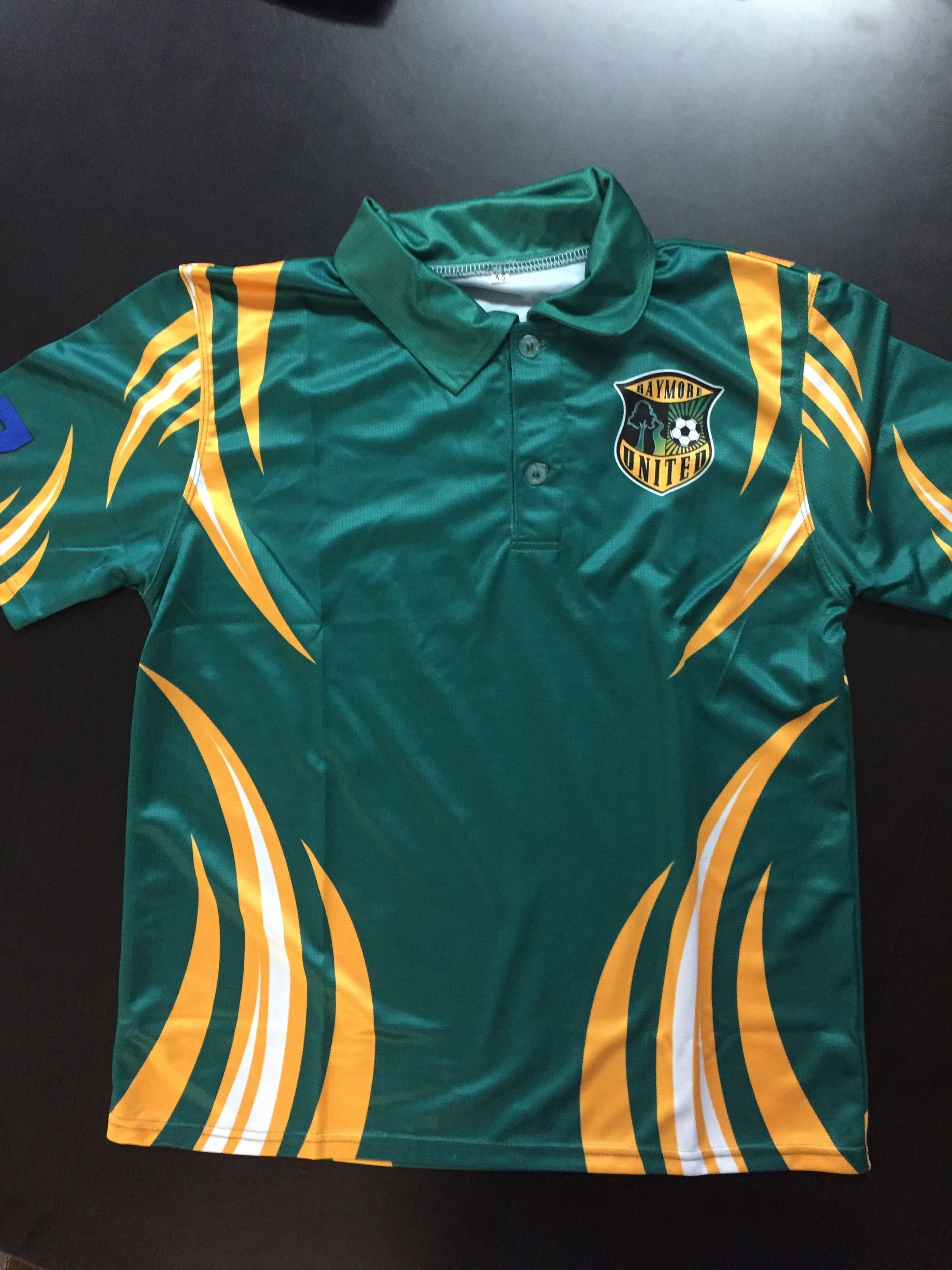 Green and gold soccer polo shirt with team logo.