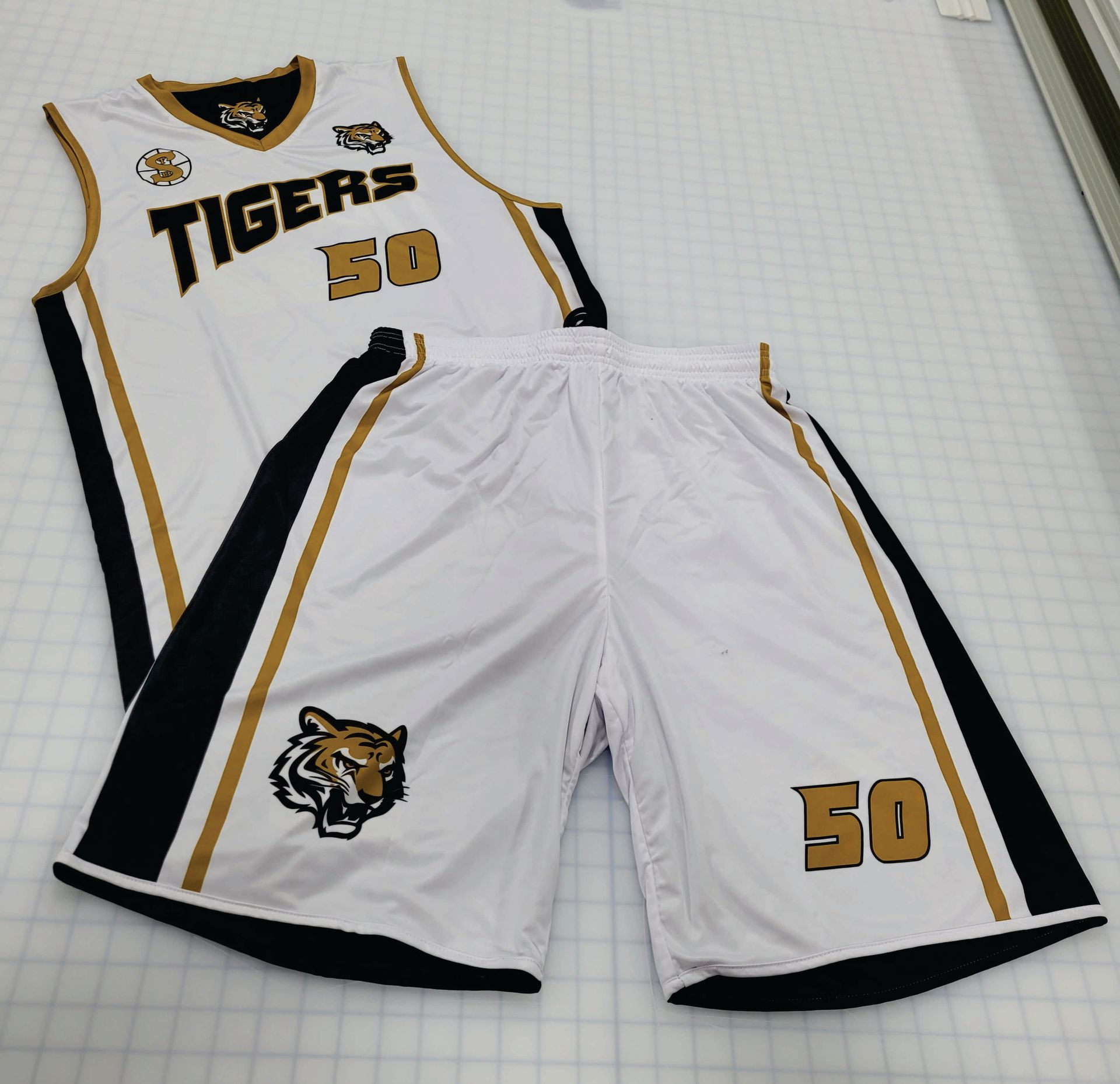 White and gold basketball uniform