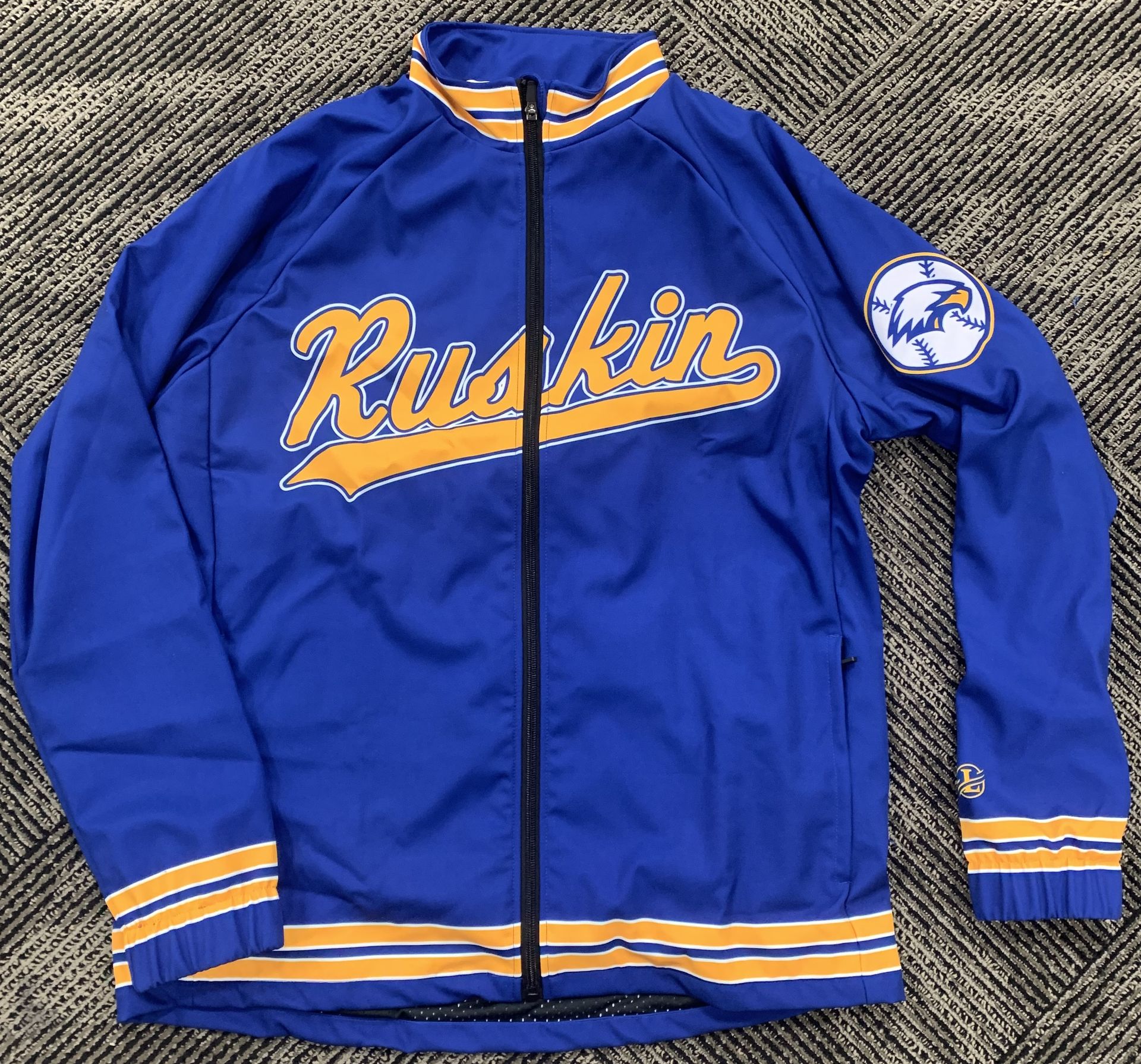 Blue jacket with Ruskin in yellow
