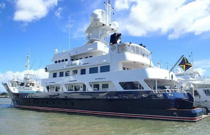 A large white and blue yacht is docked in the water — Marine Surveying in Cairns, QLD