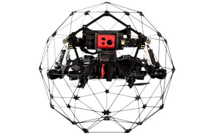 A drone is sitting inside of a cage on a white background — Marine Surveying in Cairns, QLD