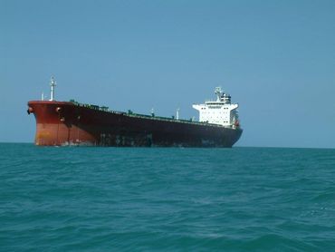 A large ship is in the middle of the ocean — Marine Surveying in Cairns, QLD