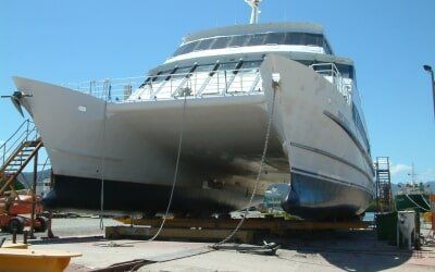 A large boat is sitting on a trailer in a marina — Marine Surveying in Cairns, QLD