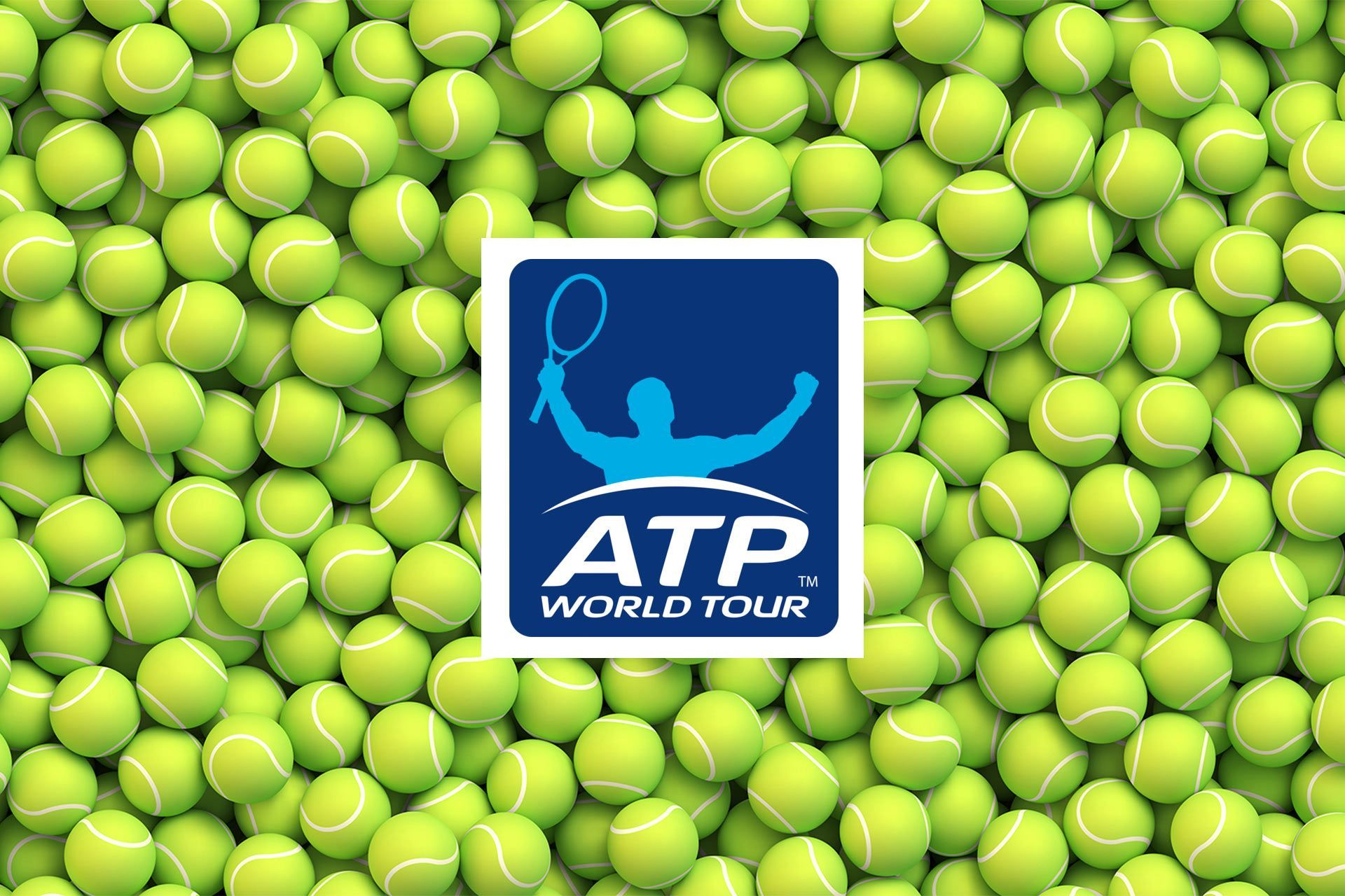 A bunch of tennis balls with the atp world tour logo