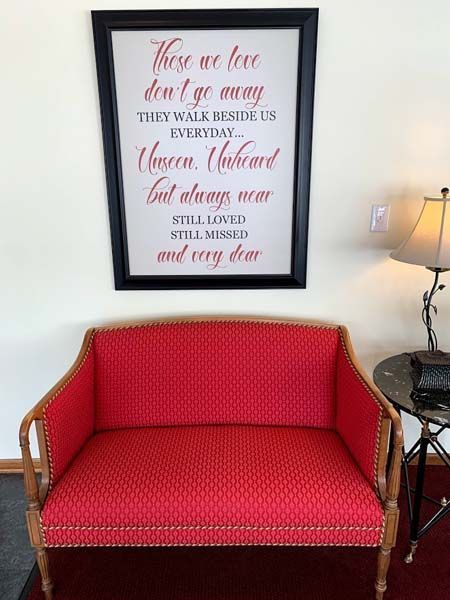 Red chair with quote in frame at Betts & West Funeral Home in Nicholasville, KY
