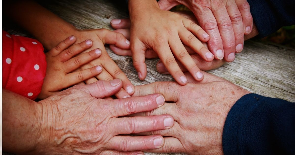 grandparents and kids holding hands