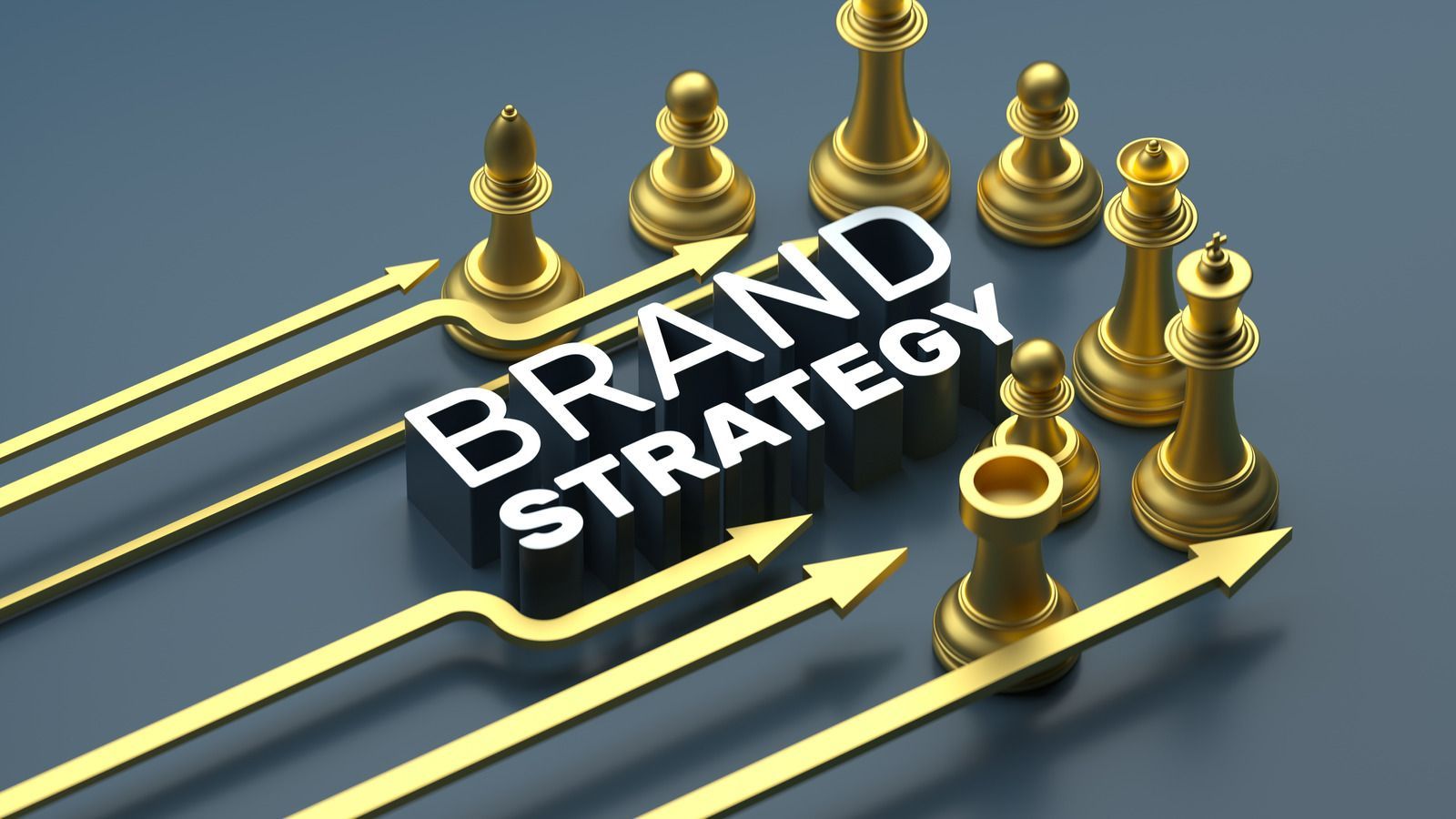 A group of gold chess pieces with arrows pointing to the word brand strategy.