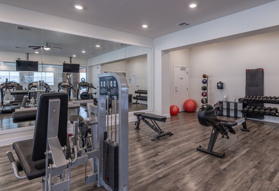 exercise room at watercolors of centerton apartments