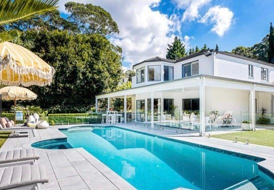 A Large White House — D & J Saverino Painting & Decorating Pty Ltd In Fairy Meadow, NSW